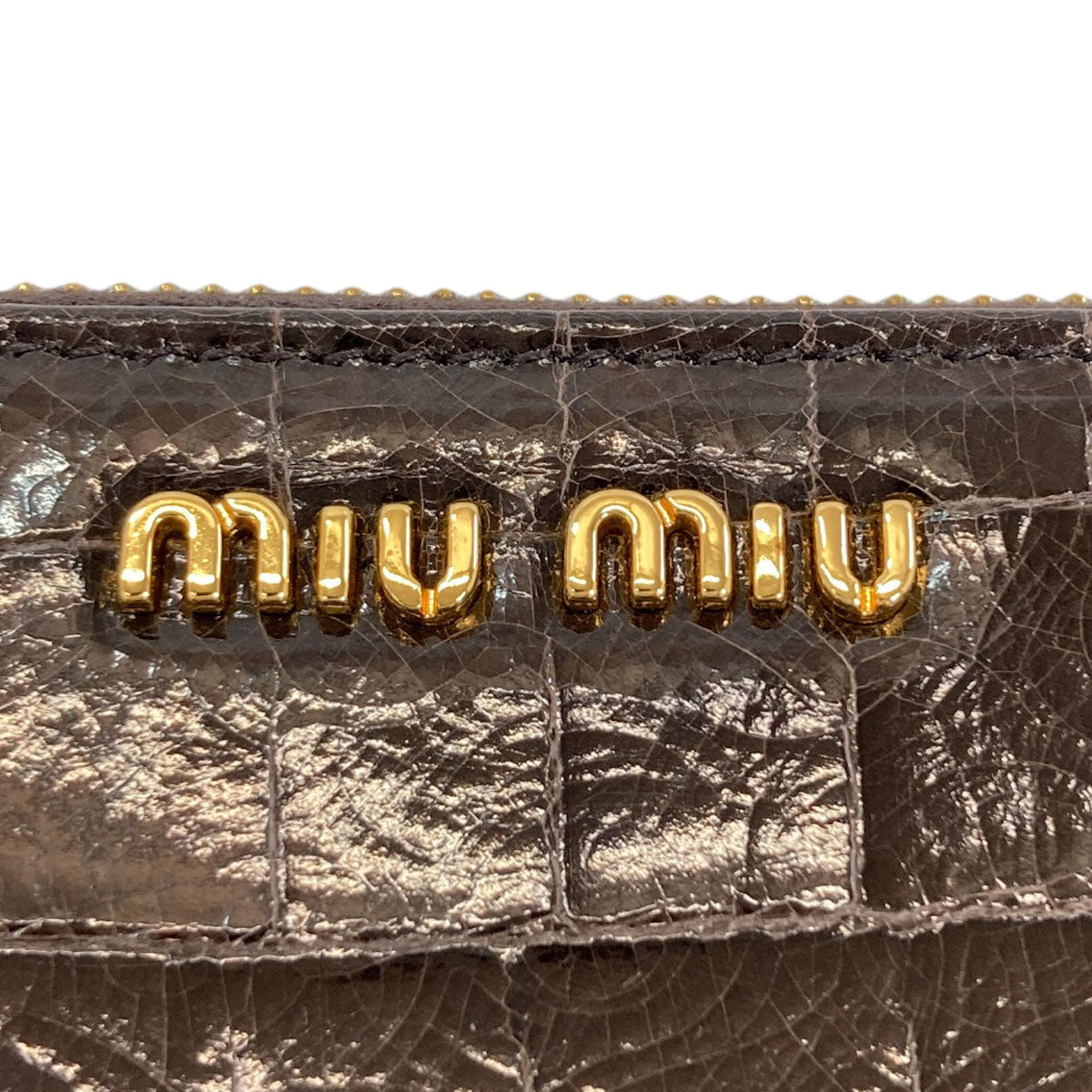 MIUMIU Embossing Long wallet (with coin pocket) Leather Ladies [Used]
