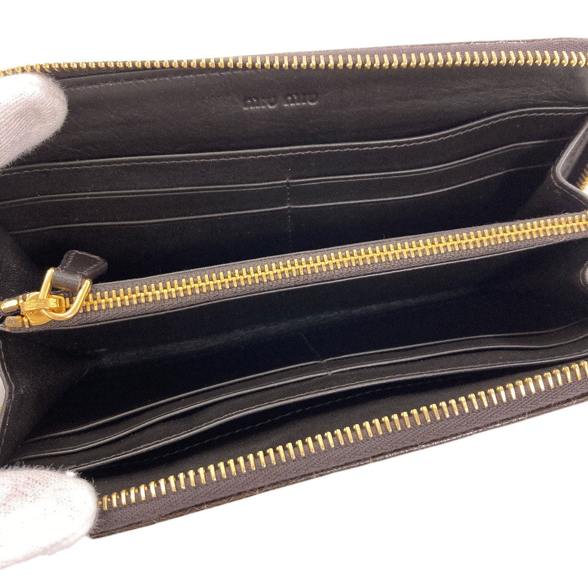 MIUMIU Embossing Long wallet (with coin pocket) Leather Ladies [Used]