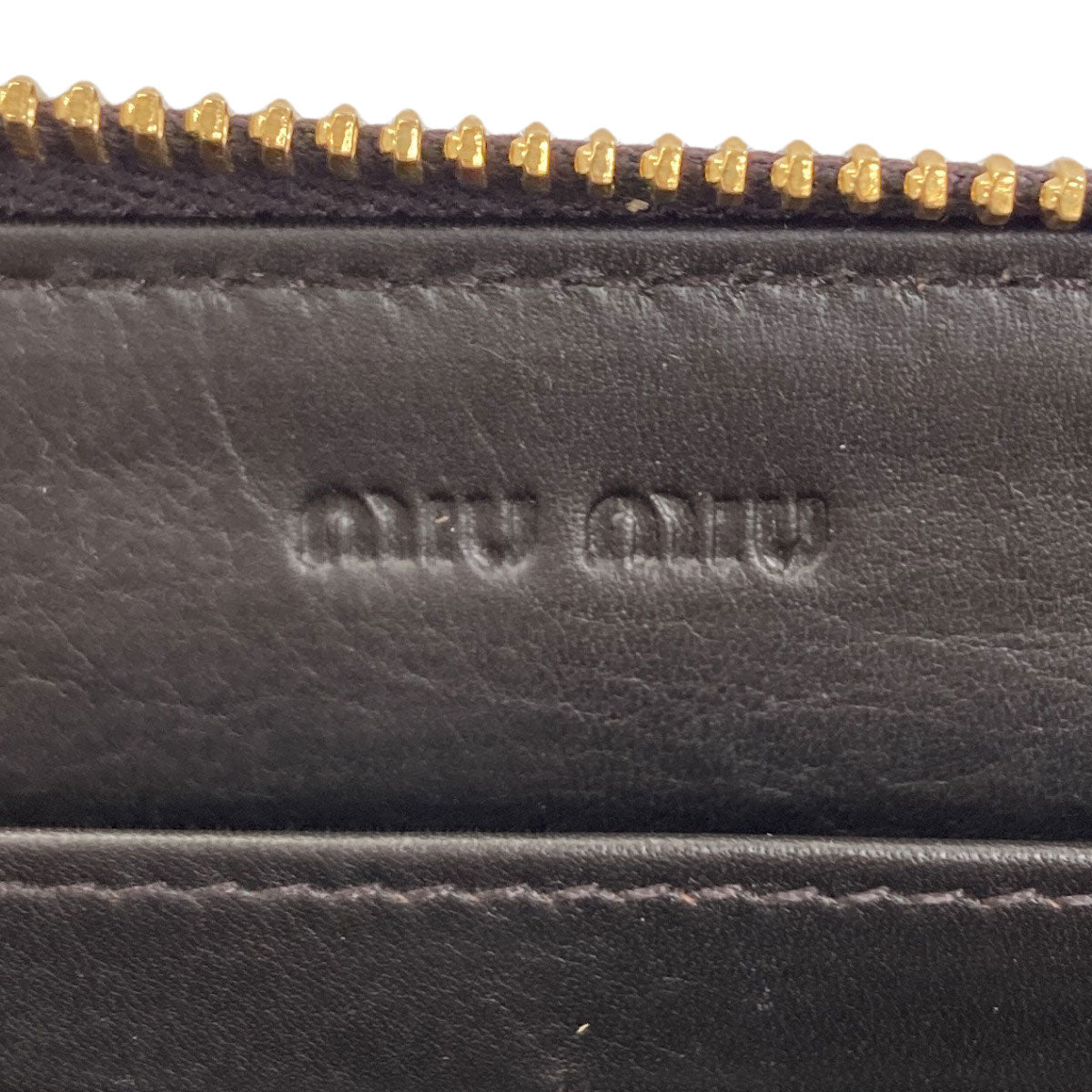 MIUMIU Embossing Long wallet (with coin pocket) Leather Ladies [Used]